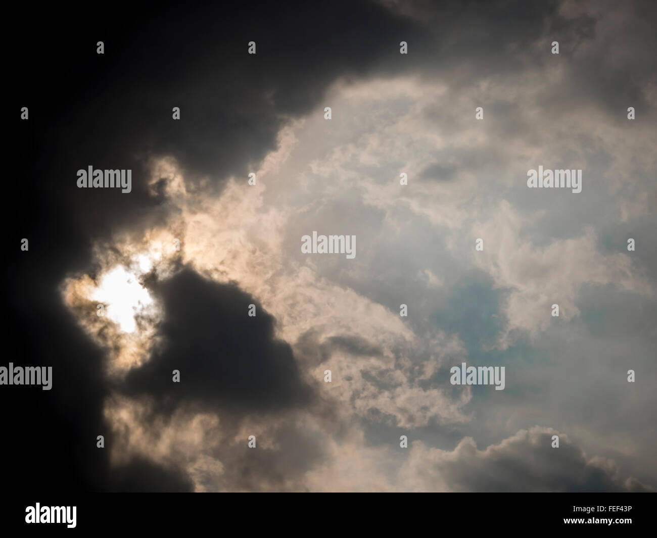 Light bleeding through dark clouds Stock Photo Alamy