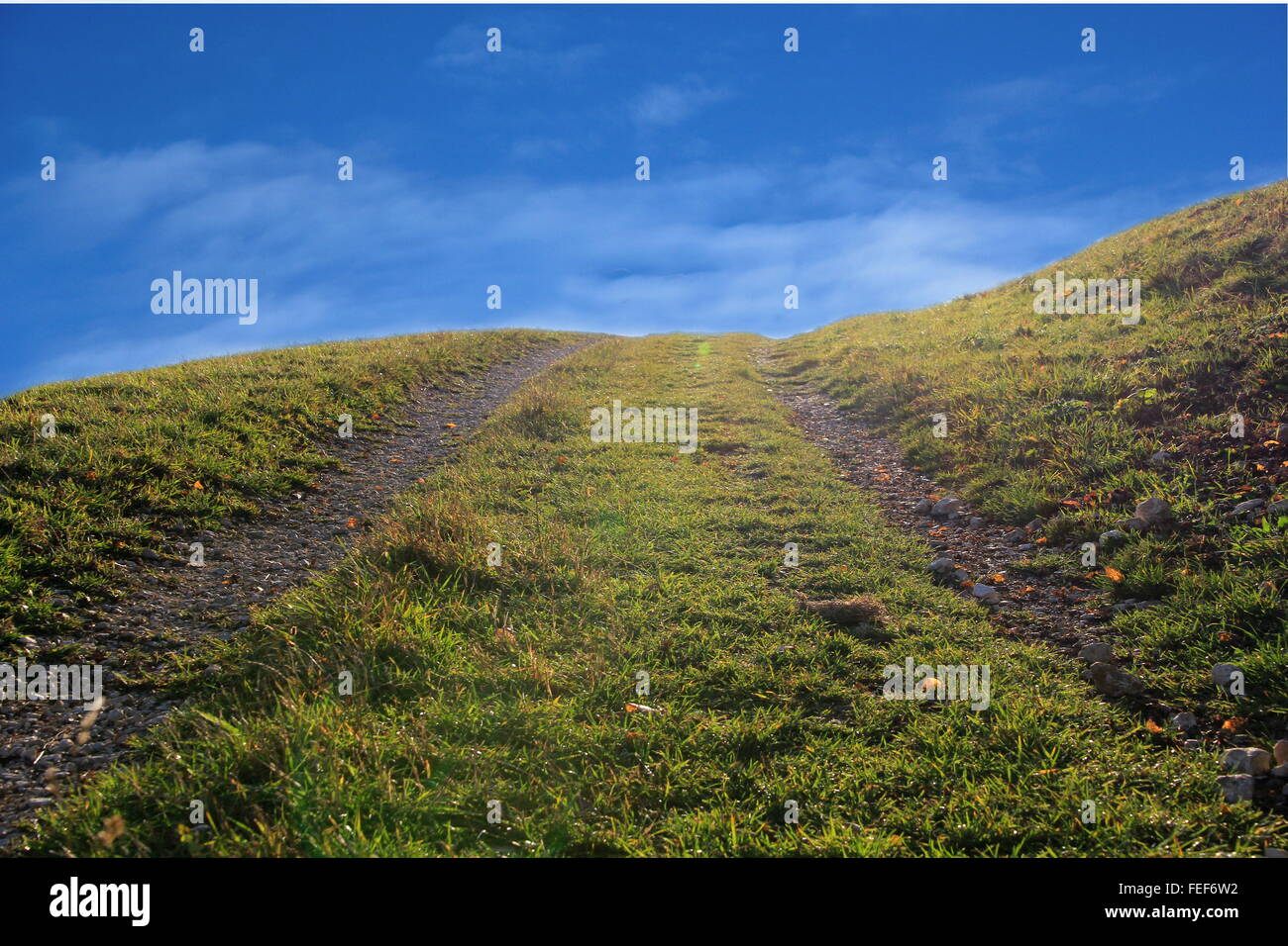 walking track leads in the blue sky Stock Photo