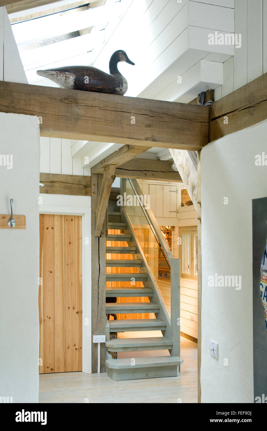 new house interior, white painted wood, oak beams, stairs and hallway Stock Photo