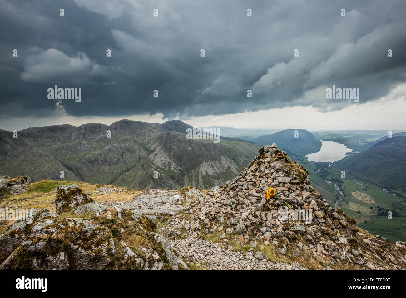 Looking across to the Scafell pike mountain range from the westmorland memorial cairn on great gable. Stock Photo