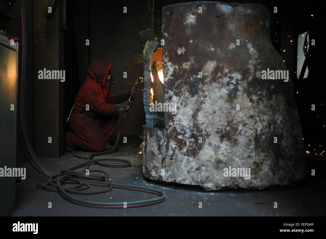 a technician removing radioactive waste in the project