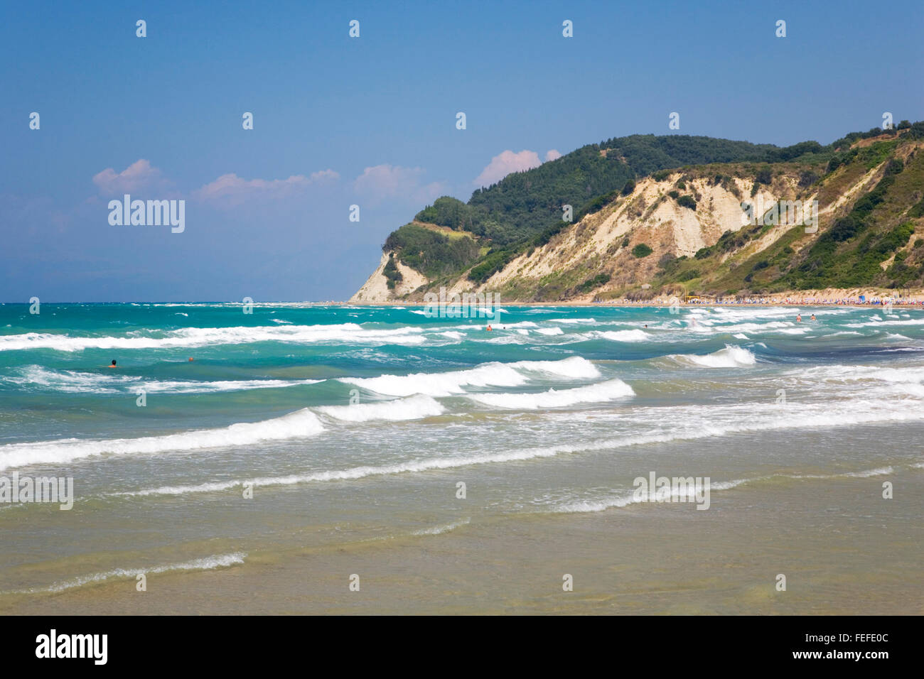 Agios Stefanos (west), Corfu, Ionian Islands, Greece. View across rough turquoise sea, waves rolling in. Stock Photo