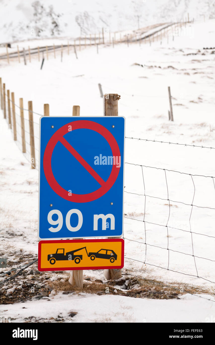 Road traffic signs alongside snow covered roadsides in Iceland in January Stock Photo