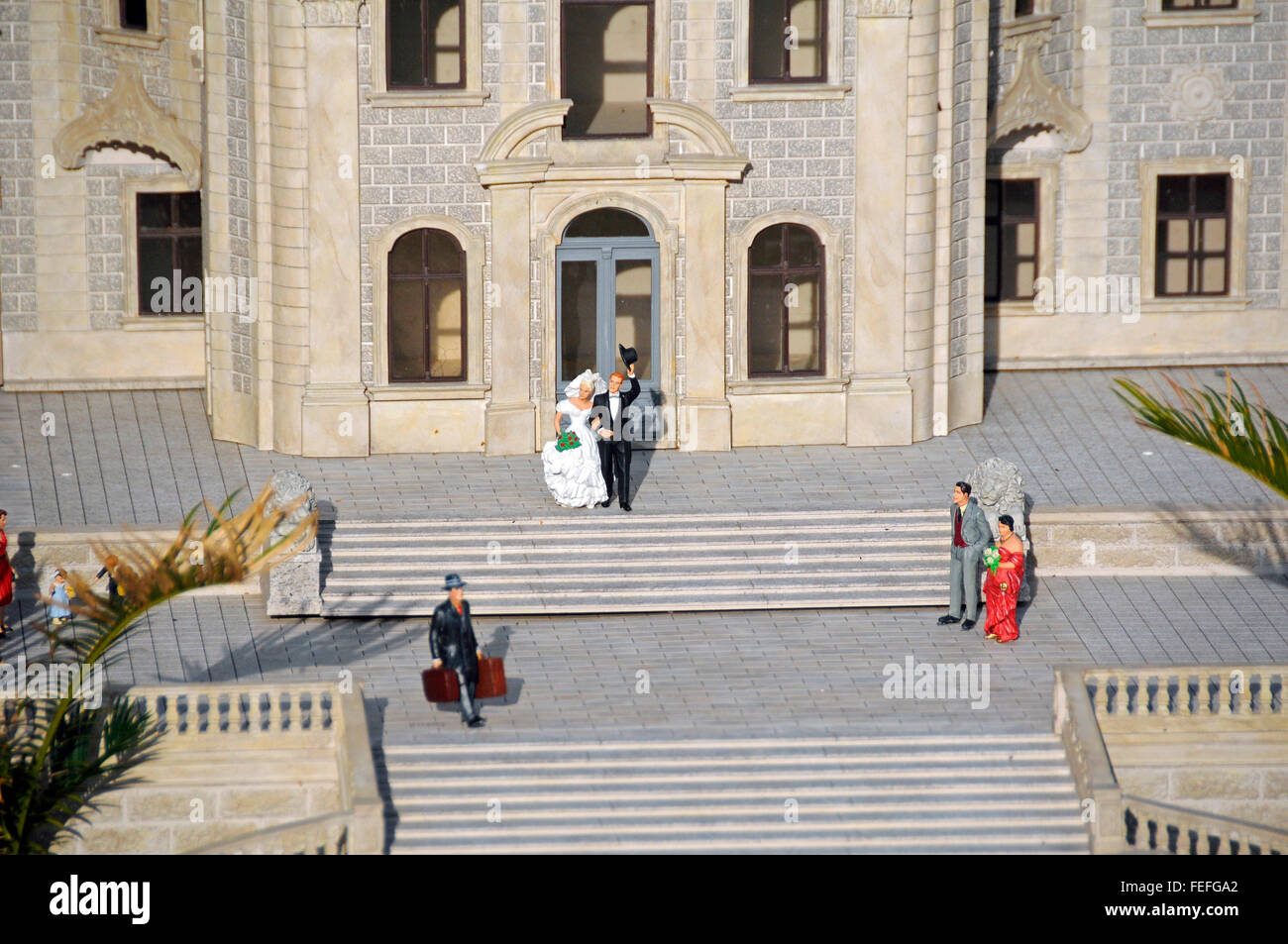 Wedding couple bride groom in miniture replica of Moszna Castle in Lower Silesia Kowary Miniature Park, Poland Stock Photo