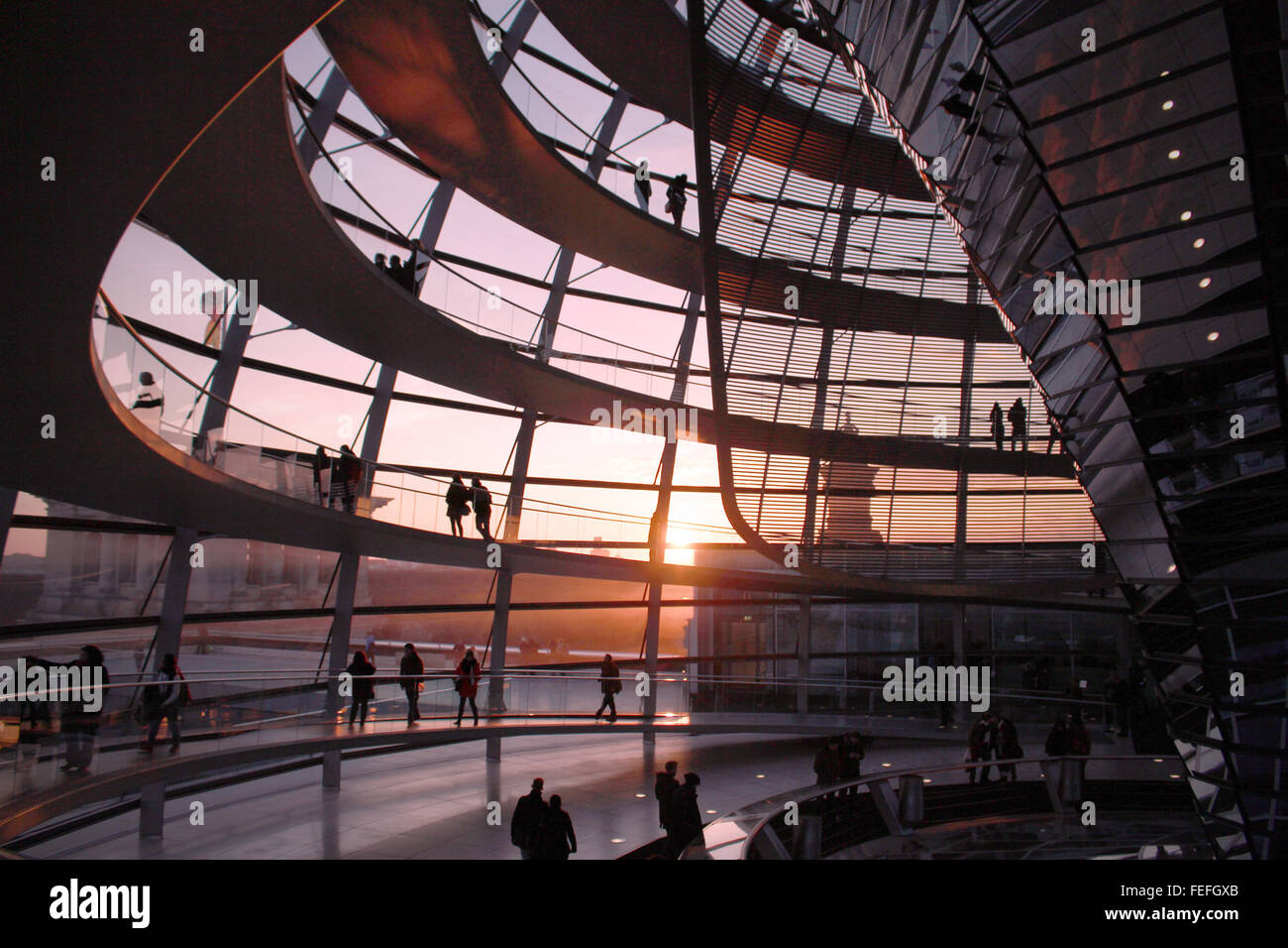 Germany Berlin Reichstag Parliament Interior of Glass Dome  design by Norman Foster  during sunset Stock Photo