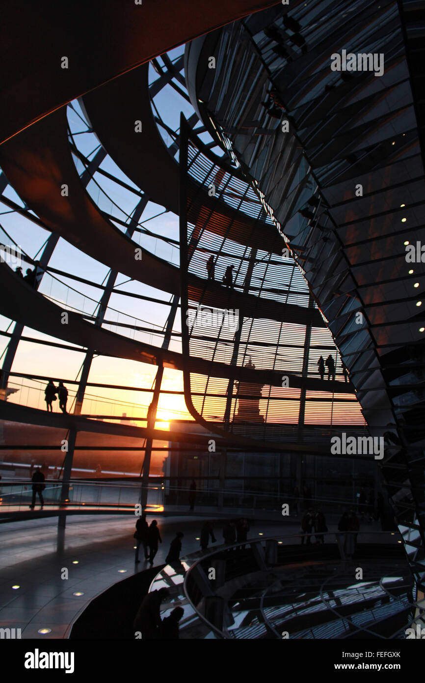 Germany Berlin Reichstag Parliament Interior of Glass Dome  design by Norman Foster  during sunset Stock Photo