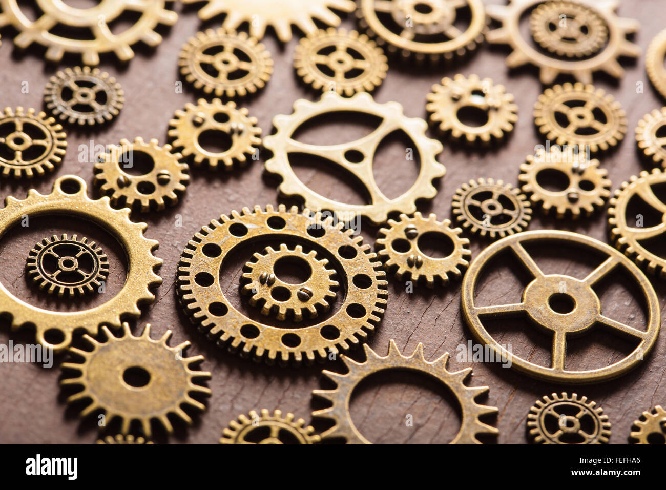 steampunk mechanical cogs gears wheels on wooden background Stock Photo ...