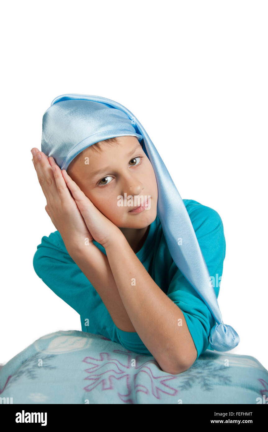 Boy in blue pajamas and sleeping hat isolated on white Stock Photo Alamy