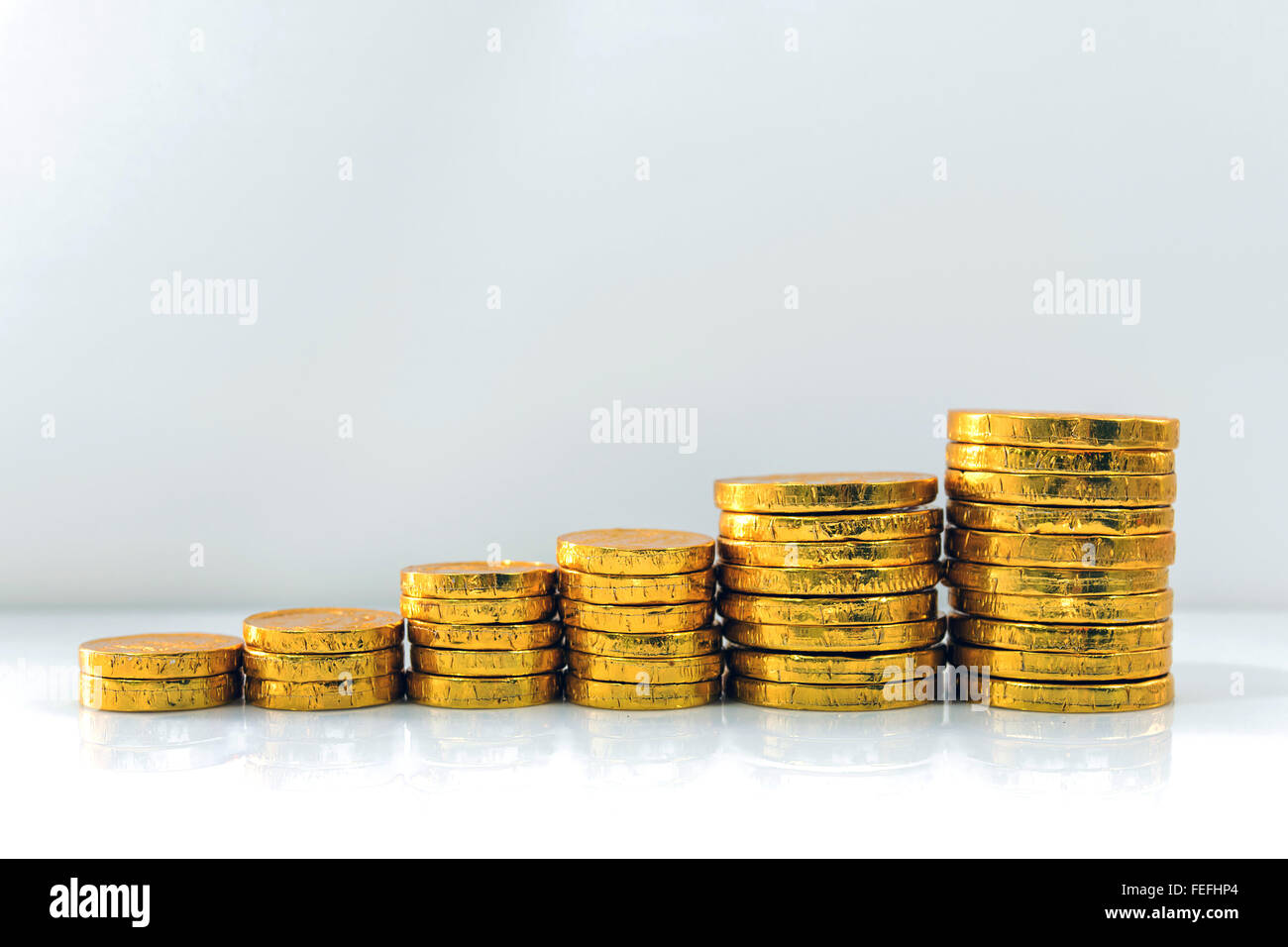 Gold coins stack isolated on white background. Stock Photo