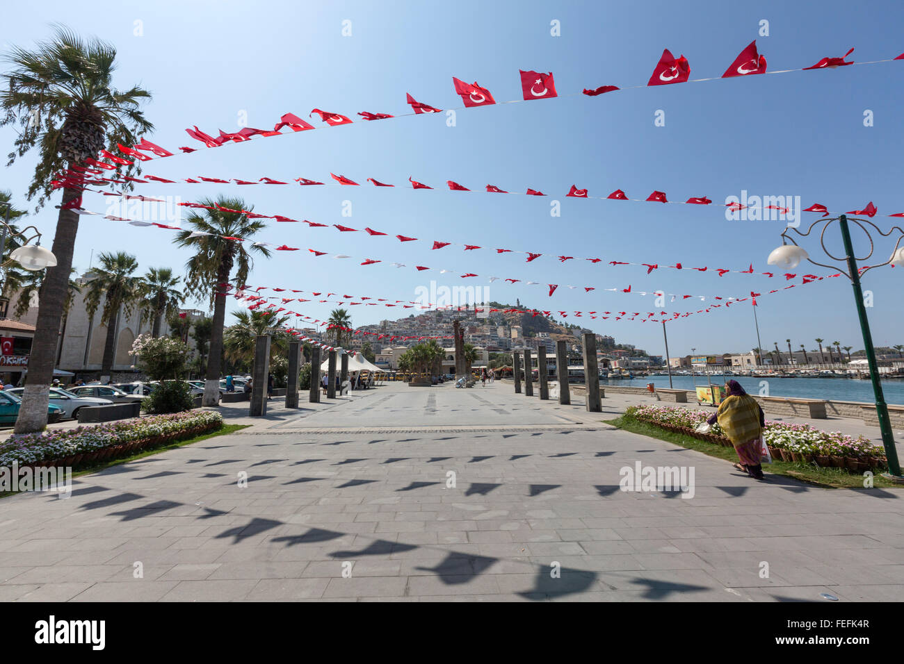 Small Turkish flags in Atatürk Boulevard in Kuşadası harbor, Turkey Stock Photo