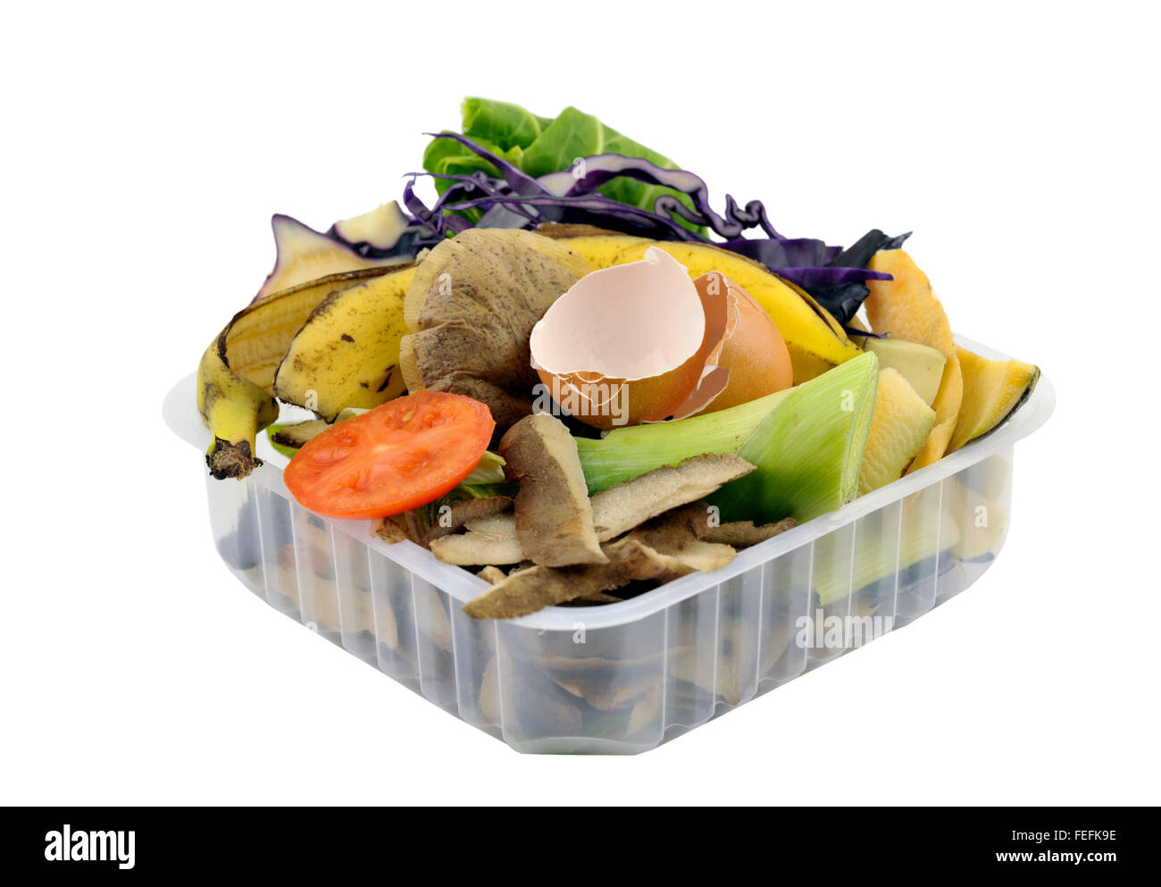Fruit and vegetable household kitchen food waste, collected in re-used packaging, for composting. Stock Photo