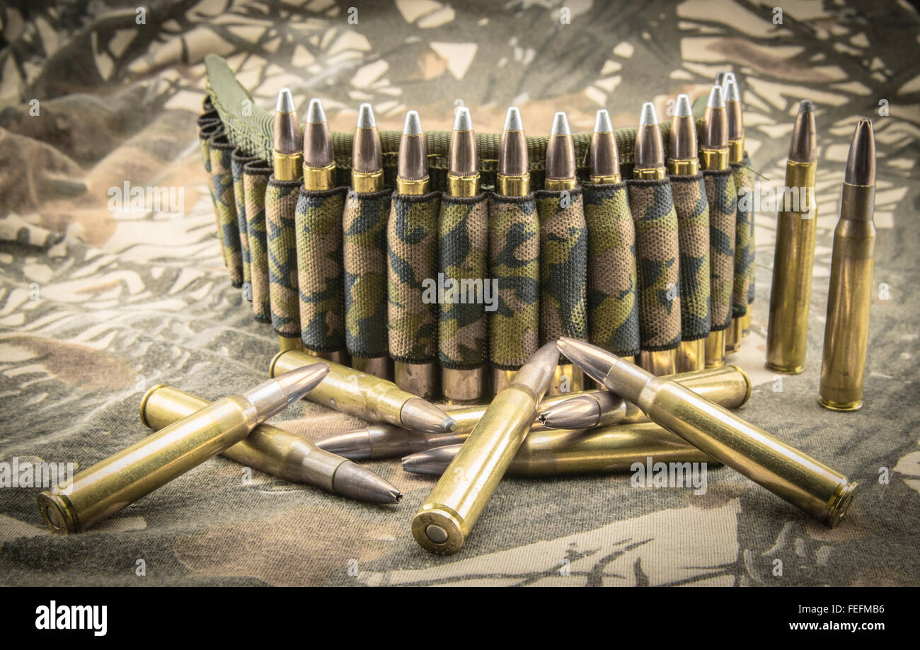 hollow-point ammunitions and camouflage ammunition belt for rifle Stock Photo