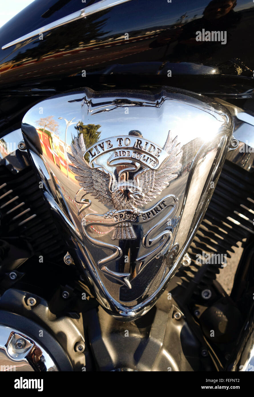 Live to ride, Ride to live engraved on air cleaner of motorcycle. Stock Photo