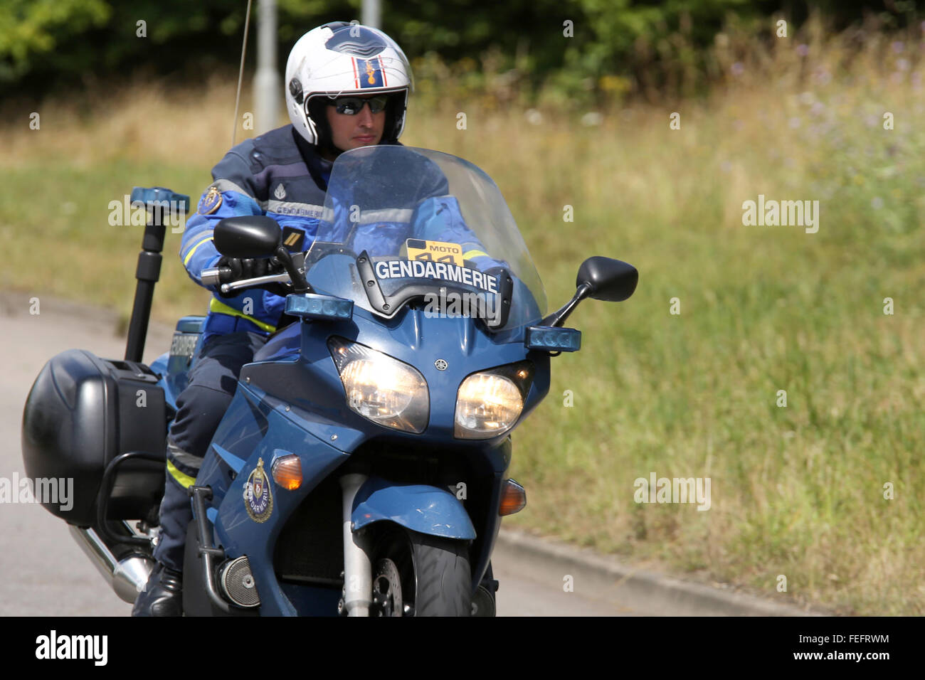 French police motorbike Gendarmerie during the Tur de France on an English  country lane in Cambridgeshire. July 2014 Stock Photo - Alamy