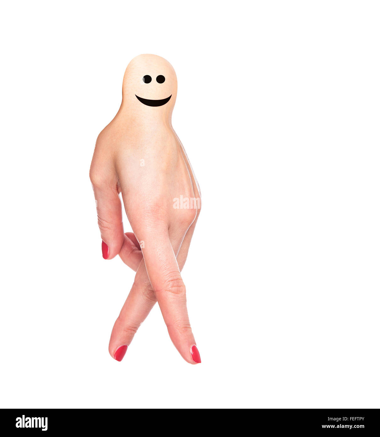 Female hand in a funny little man. Stock Photo