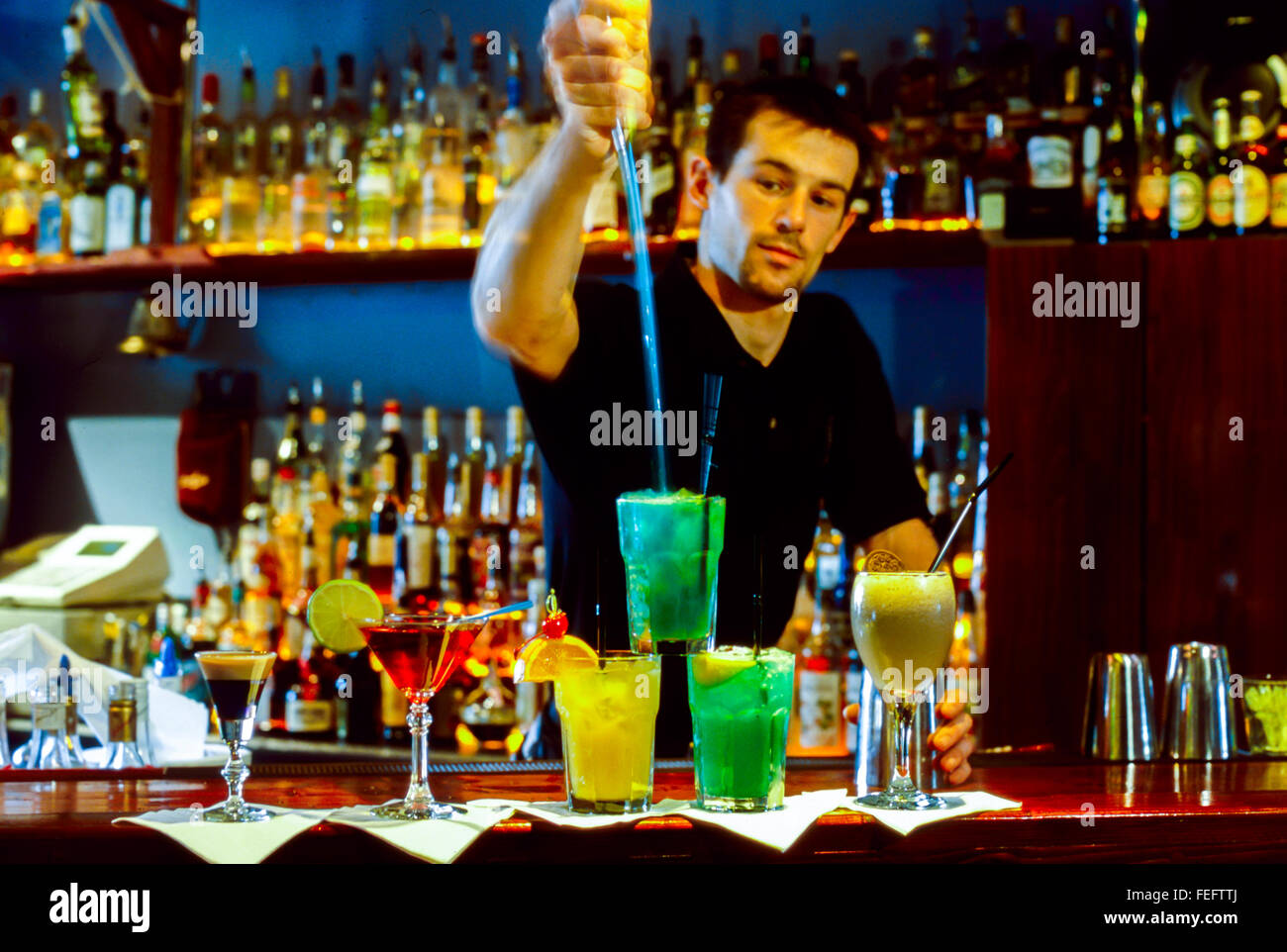 Paris, France, Bartender Pouring, Mixing Cocktail Drinks, in French Bar