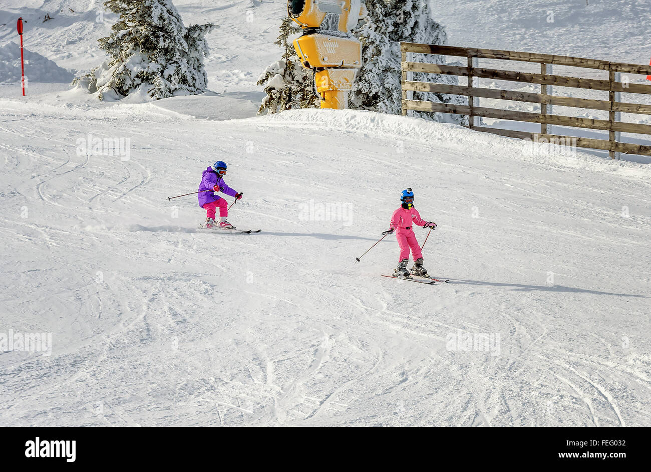 Two Little girls skiing fast downhill Stock Photo Alamy