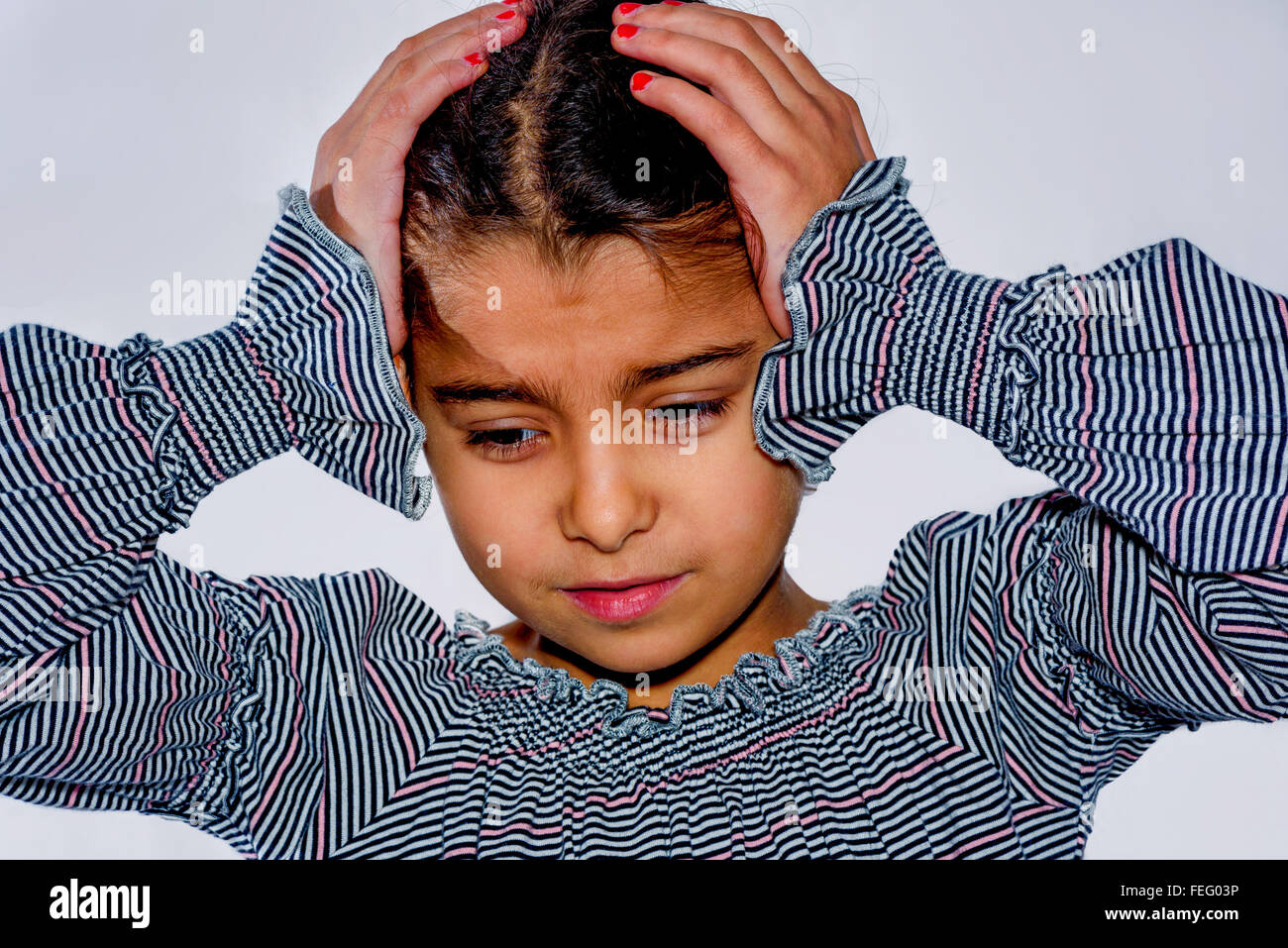 Little girl with headache isolated Stock Photo