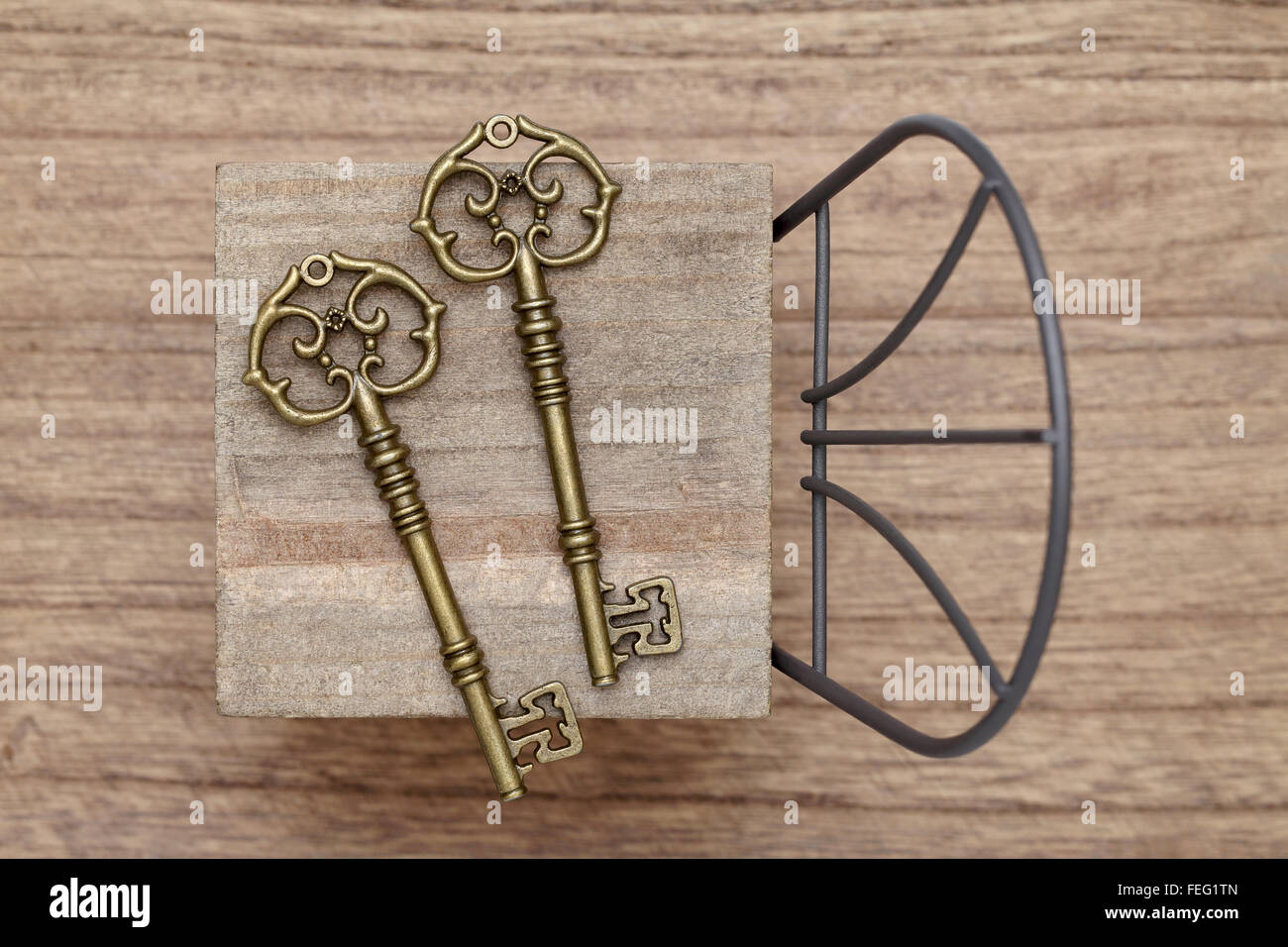 antique key with small toy chair Stock Photo