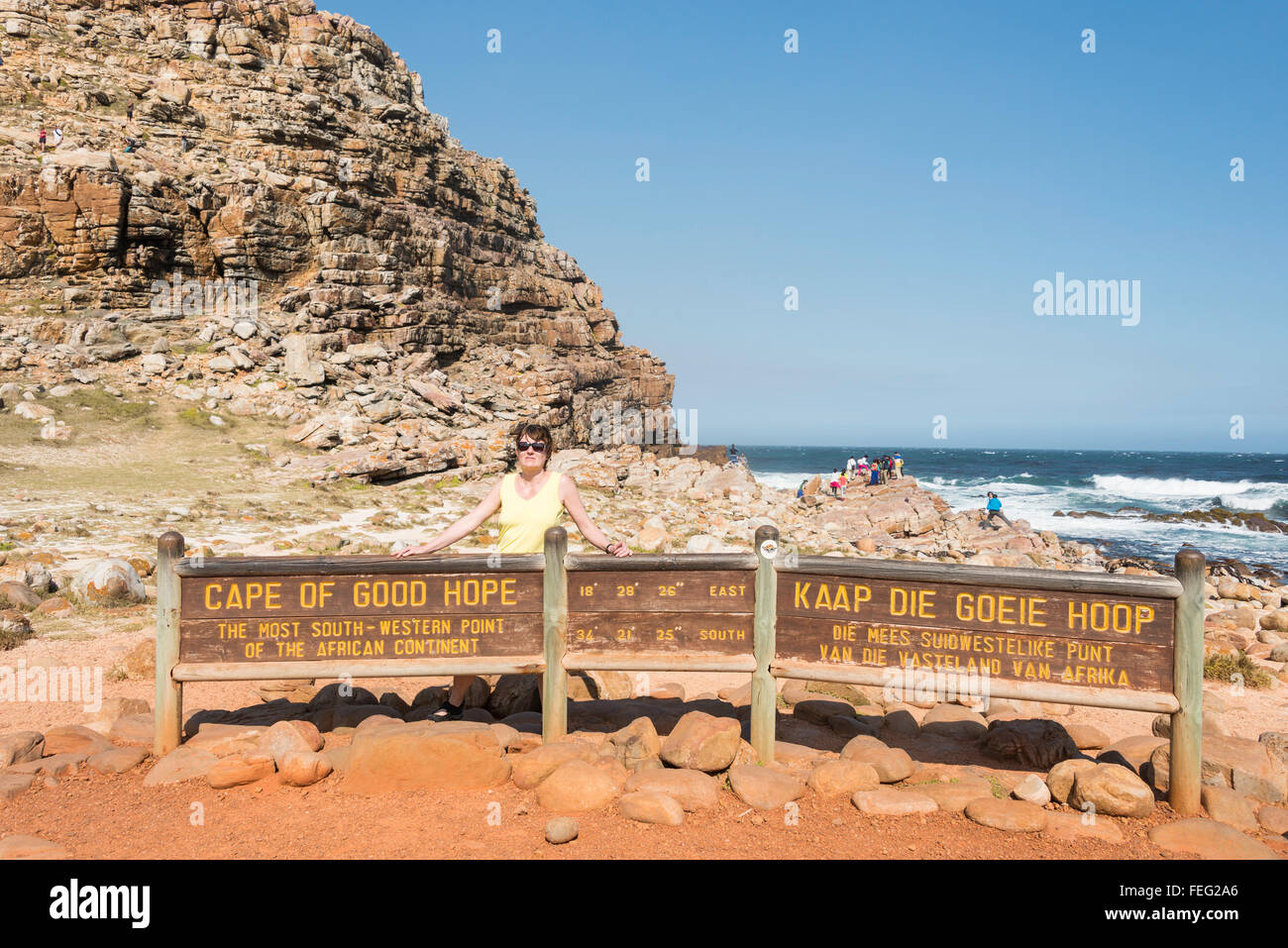 Female tourist by Cape of Good Hope sign, Cape Peninsula, City of Cape Town, Western Cape Province, Republic of South Africa Stock Photo