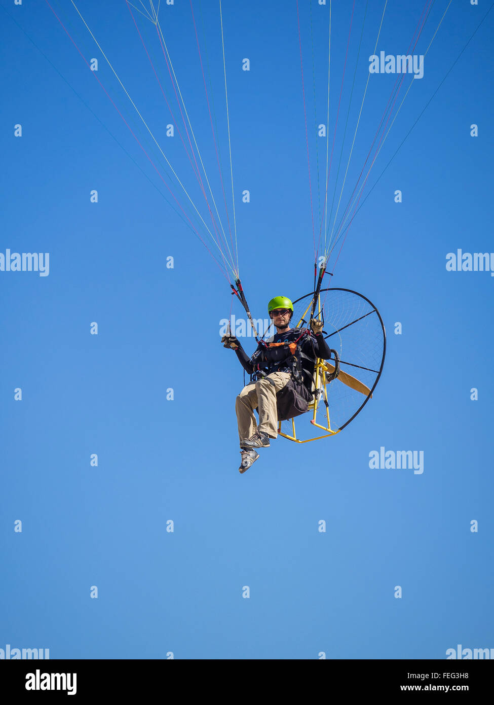 A close-up of a man flies in his paramotor ultralight in the air by the  Salton Sea, California Stock Photo - Alamy