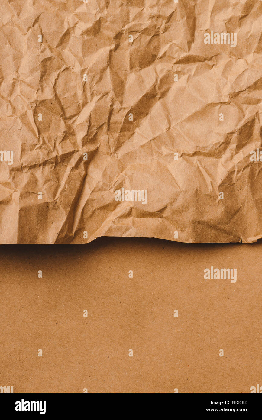 Crumpled brown kraft paper texture as background Stock Photo