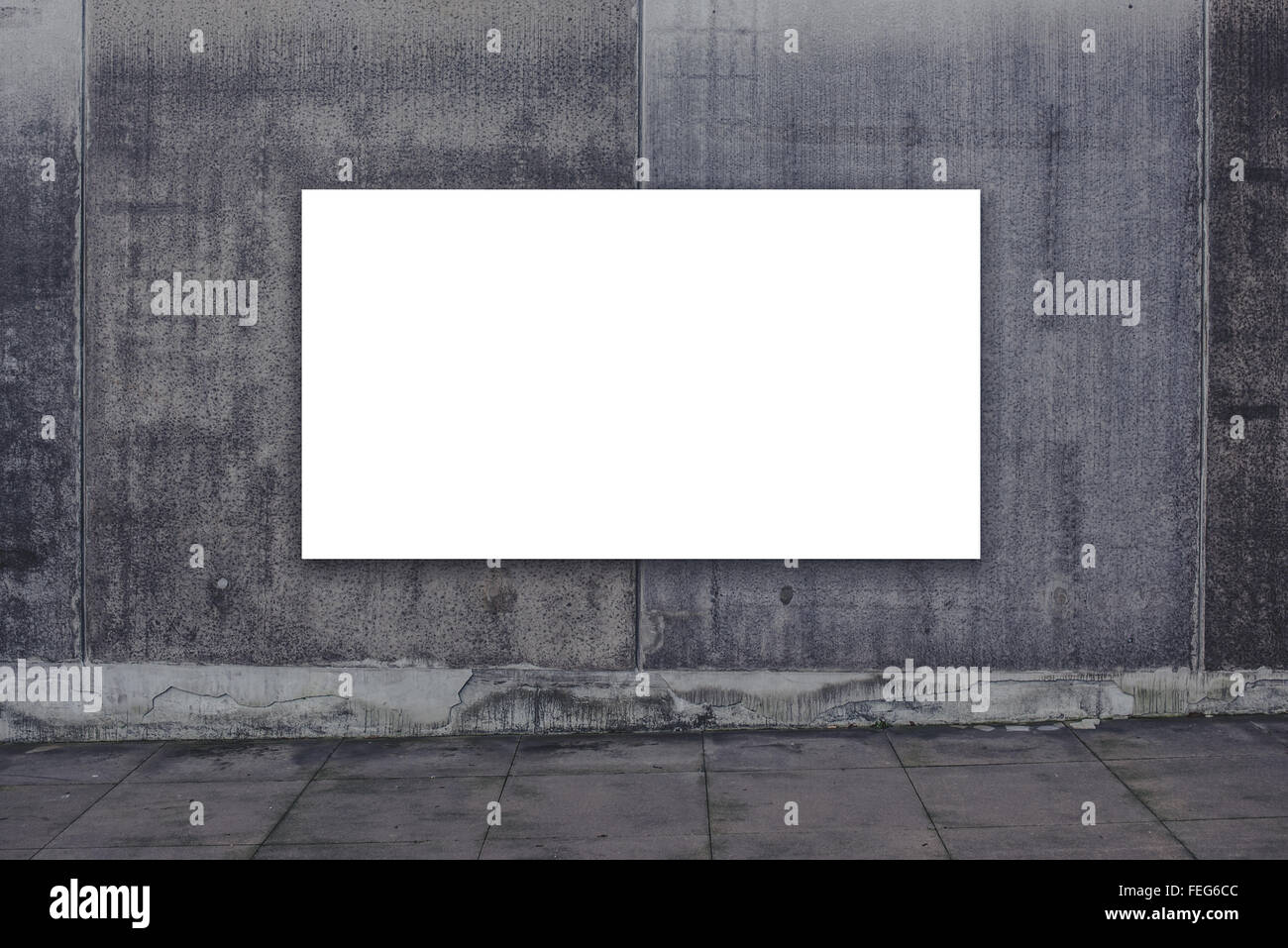 Blank advertising billboard on concrete wall as copy space for outdoor poster ad mock up. Stock Photo