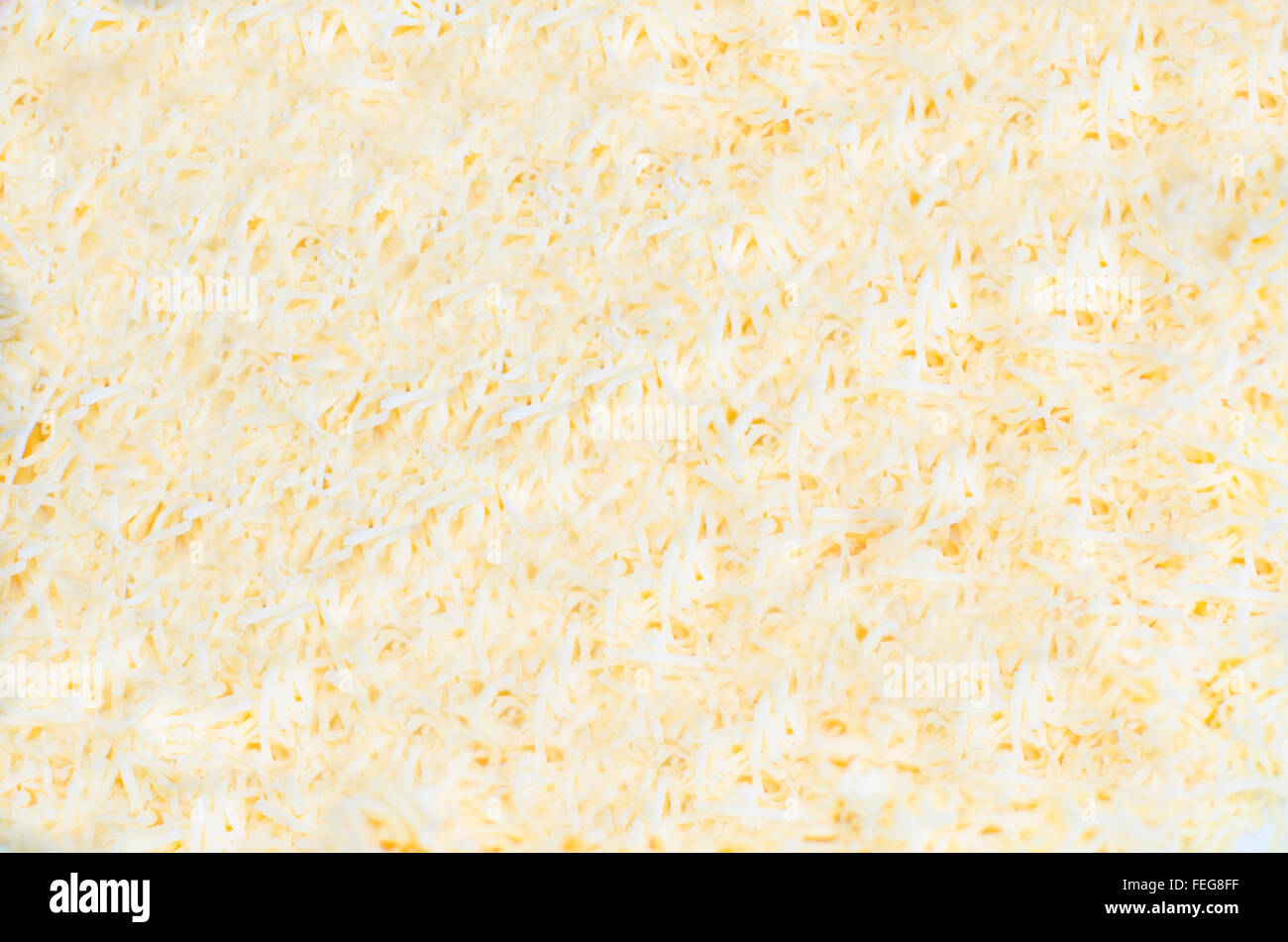 background cheese,light from a natural product,grated,background,texture,product,cheese,small,crumb,beige color Stock Photo
