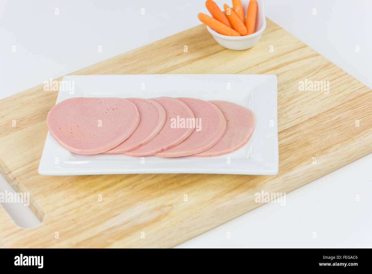 SLICED BOLOGNA SALAMI ON THE WOODEN BOARD Stock Photo Alamy