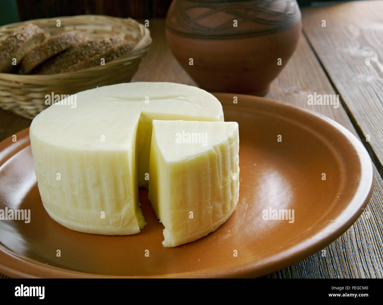 Basket cheese is an Arabic style semi-soft cheese made from cow's milk available fresh or dry Stock Photo