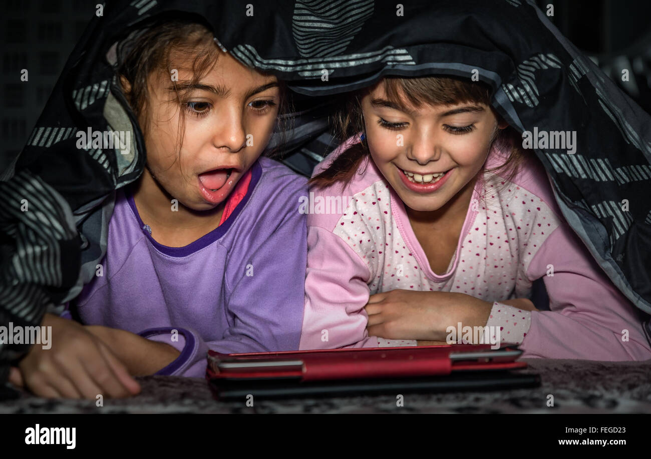 Kid hiding under blanket hires stock photography and images Alamy