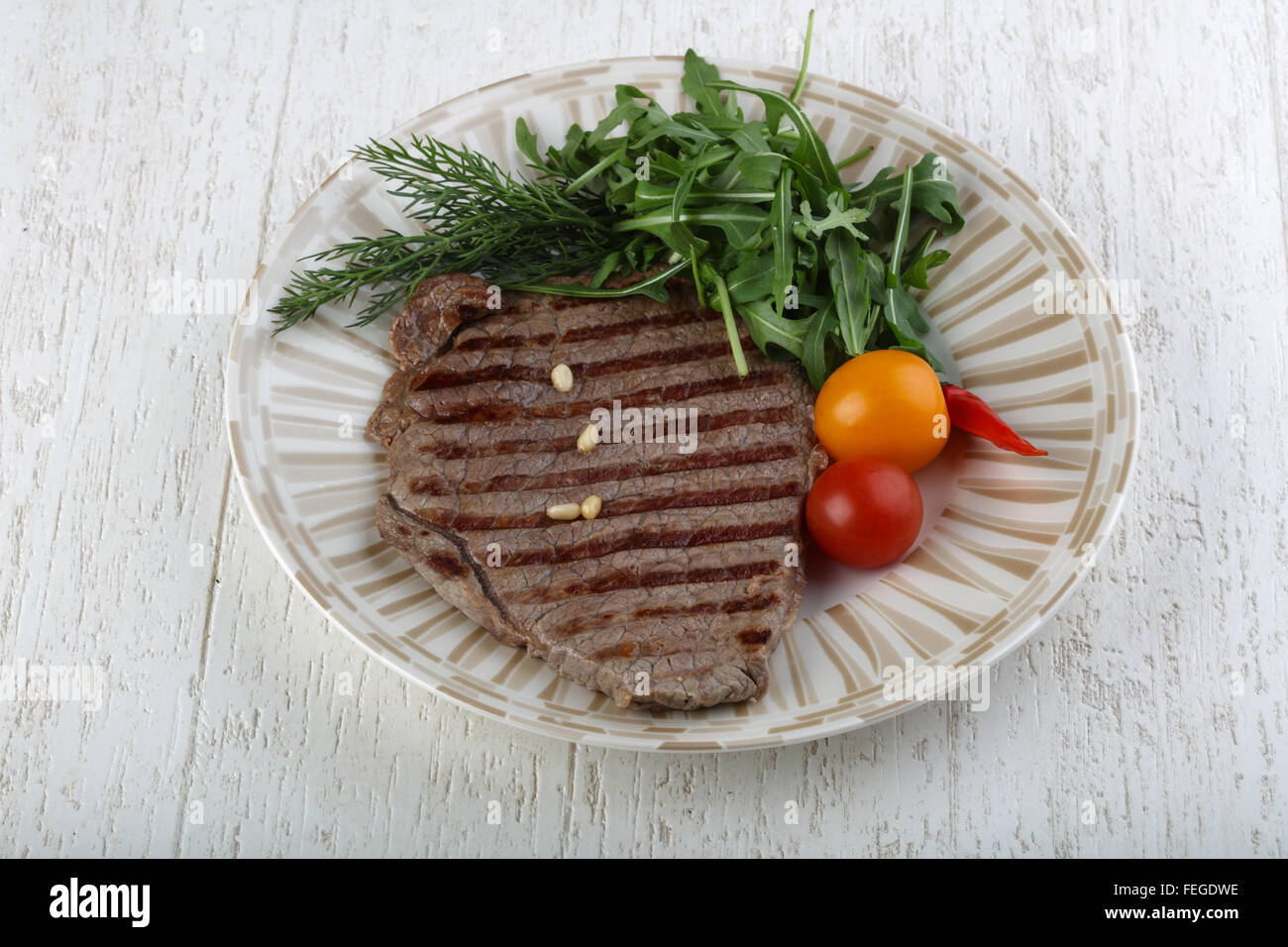 Grilled beaf steak with rucola and dill leaves Stock Photo Alamy