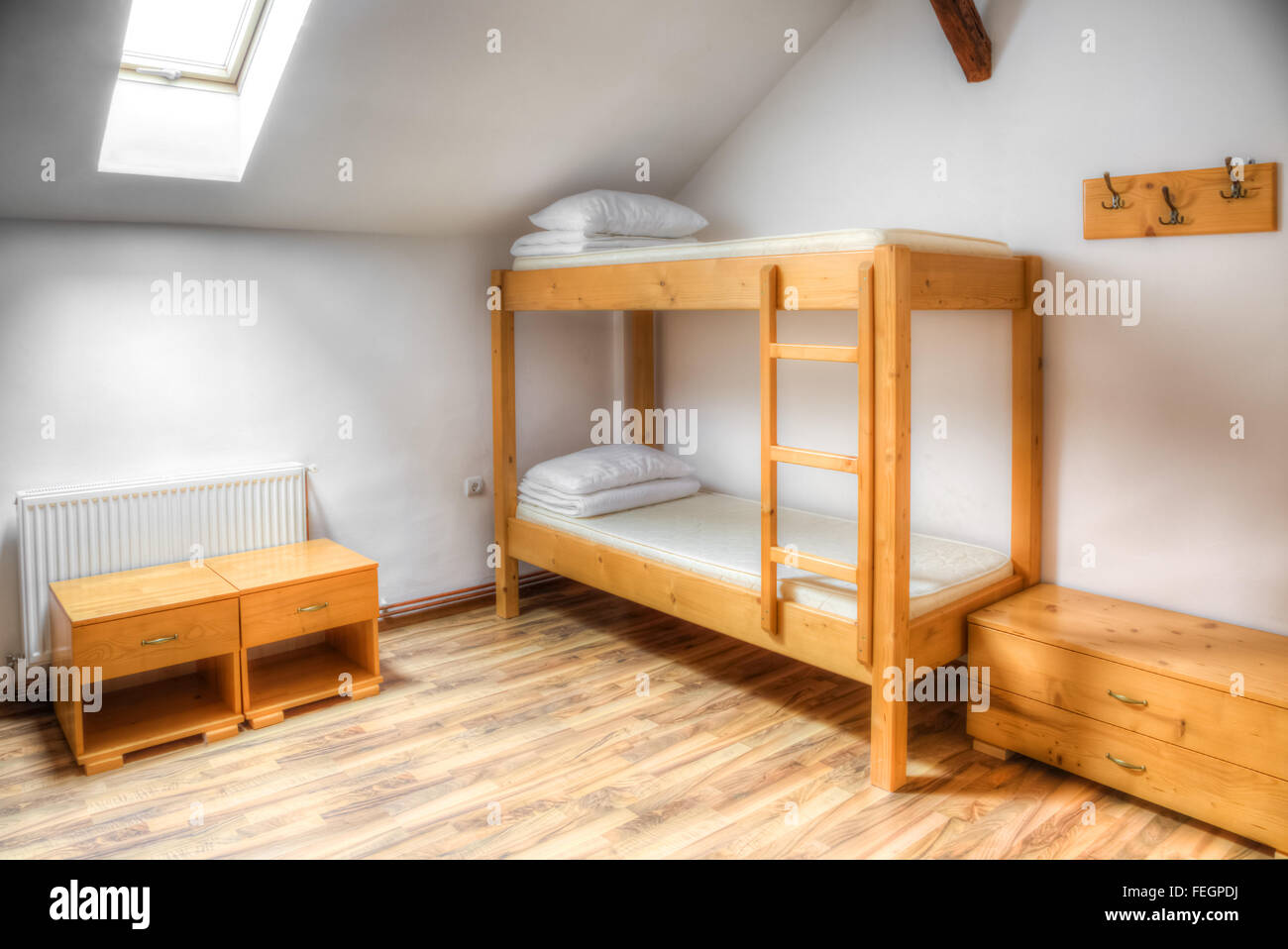 Clean hostel room with wooden bunk beds Stock Photo Alamy