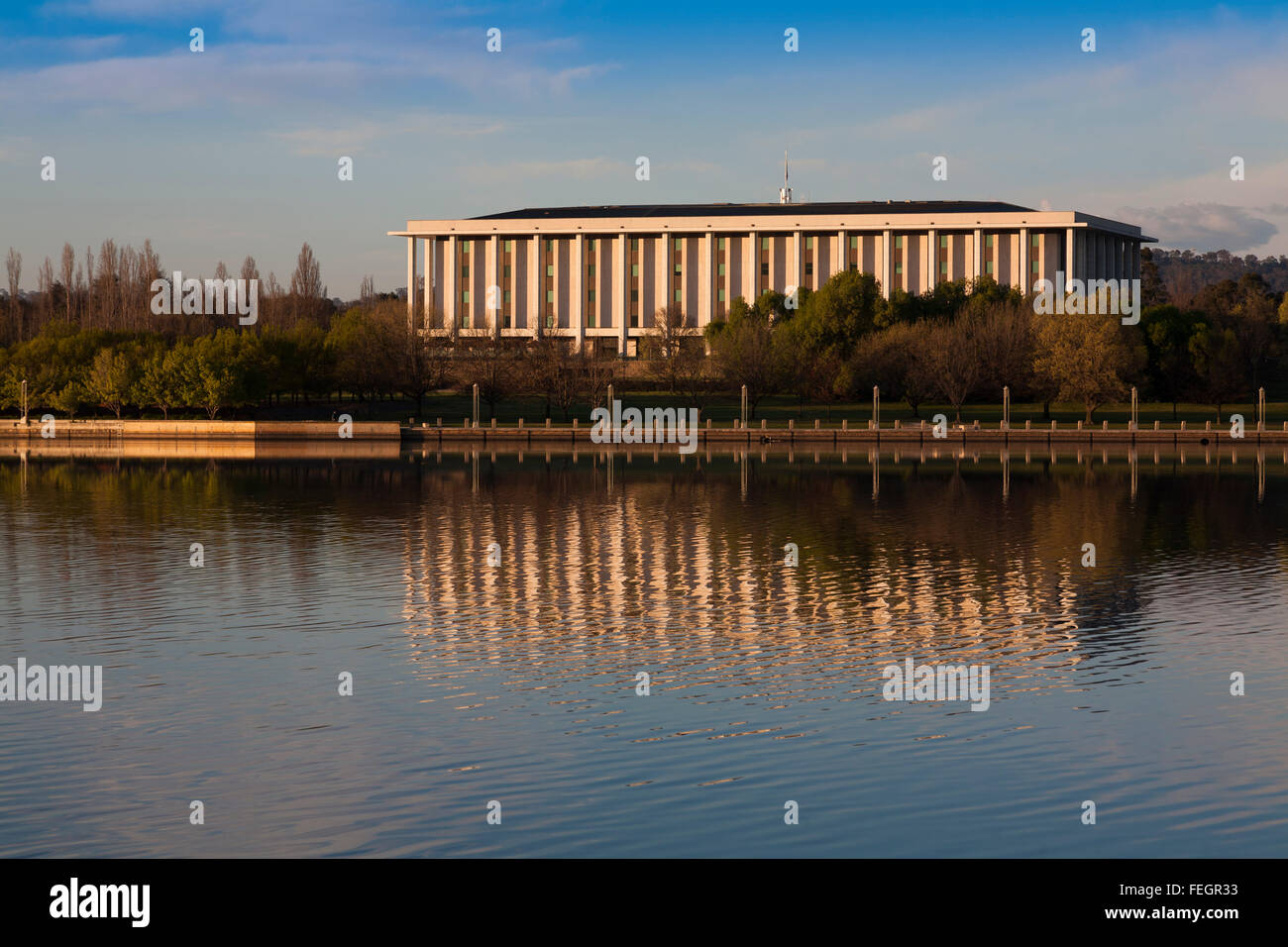 Early morning view of the National Library of Australia reflected in Lake Burley Griffin Canberra ACT Australia Stock Photo