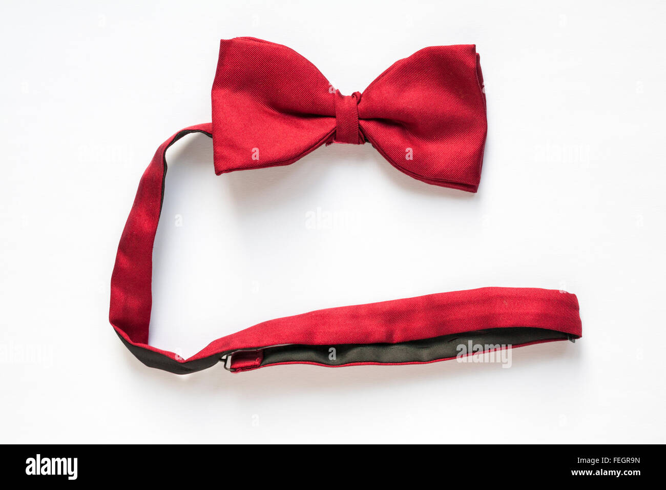 red bow tie isolated on white background Stock Photo - Alamy