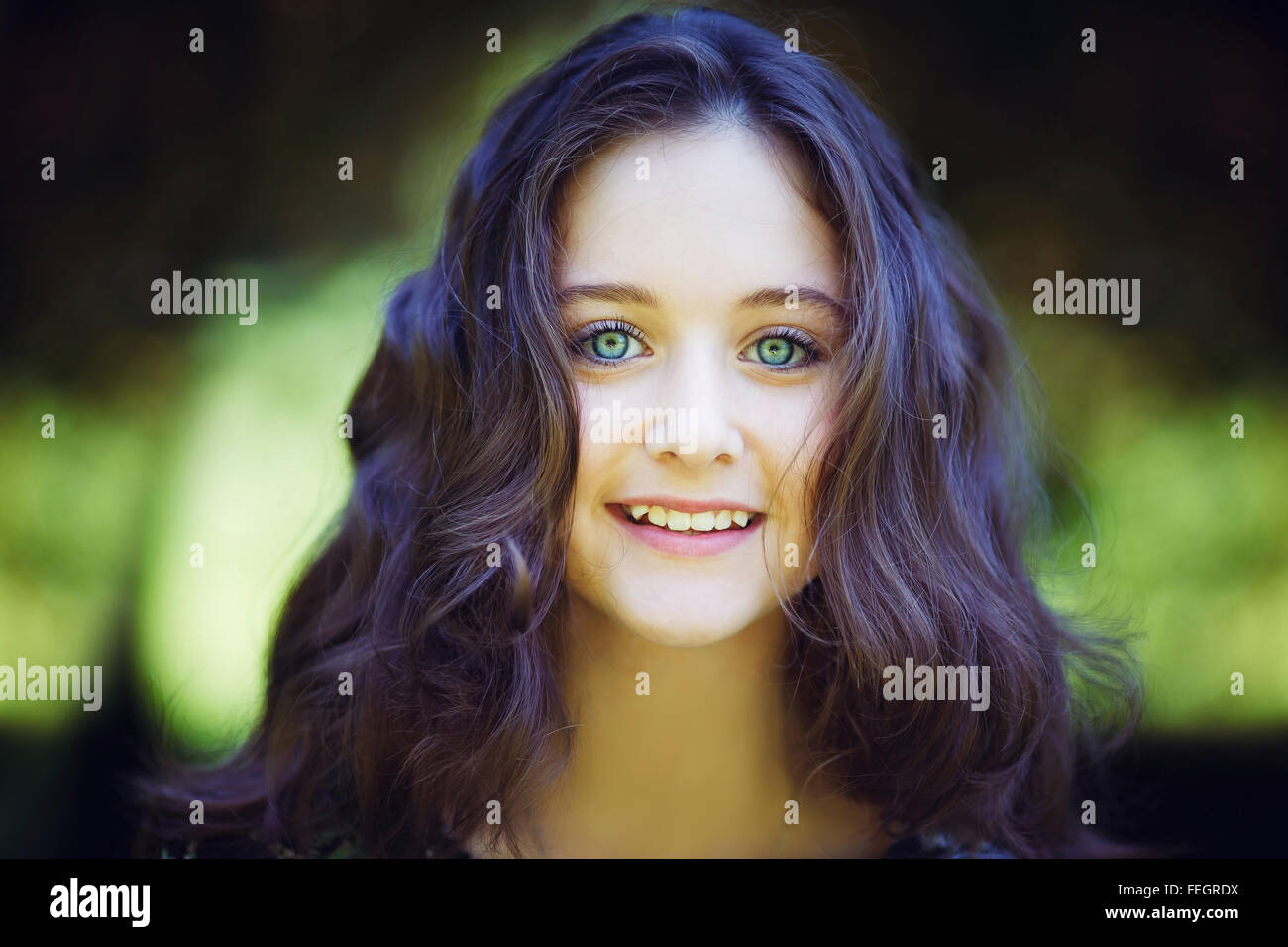 Portrait of young beautiful girl in a park Stock Photo - Alamy