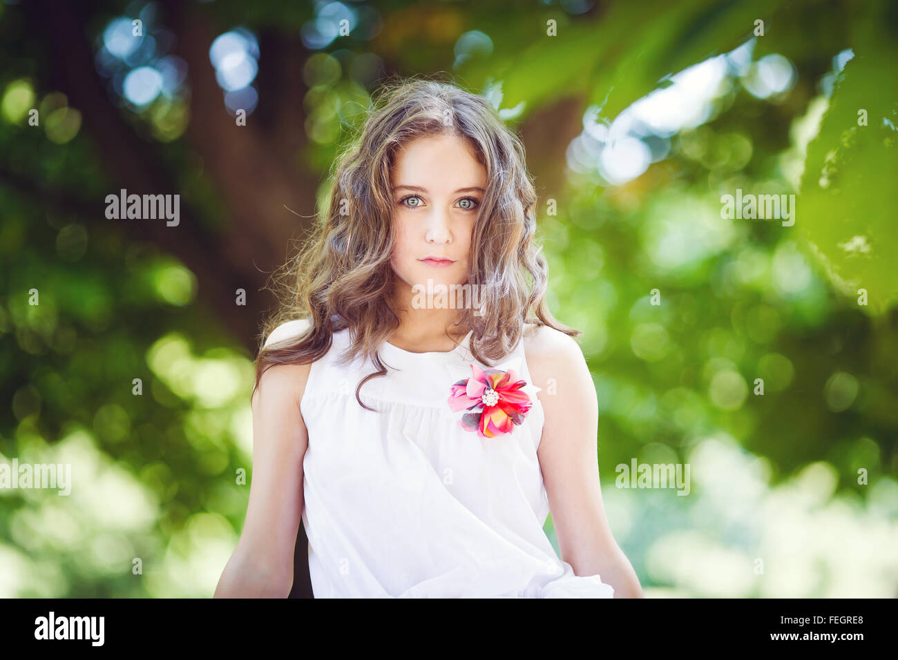 Portrait of young beautiful girl in a park at summer time Stock Photo ...