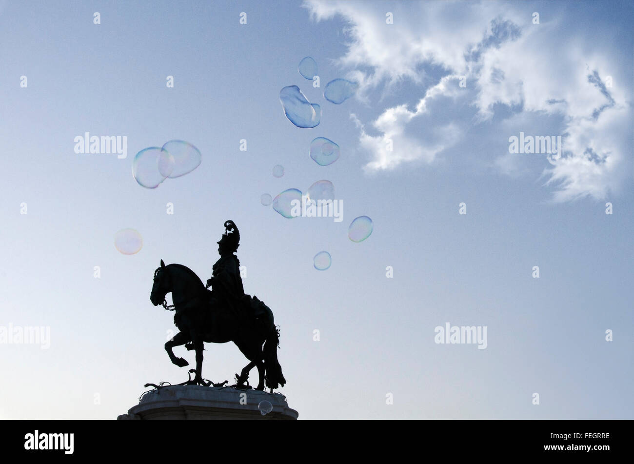 Statue of King Joseph backlit surrounded by soap bubbles in the trading center in Lisbon Stock Photo