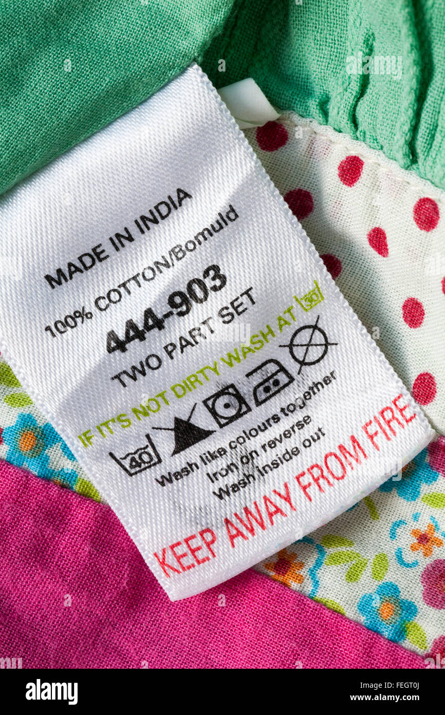 Keep away from fire label in 100% cotton garment made in India with care instructions - sold in the UK United Kingdom, Great Britain Stock Photo
