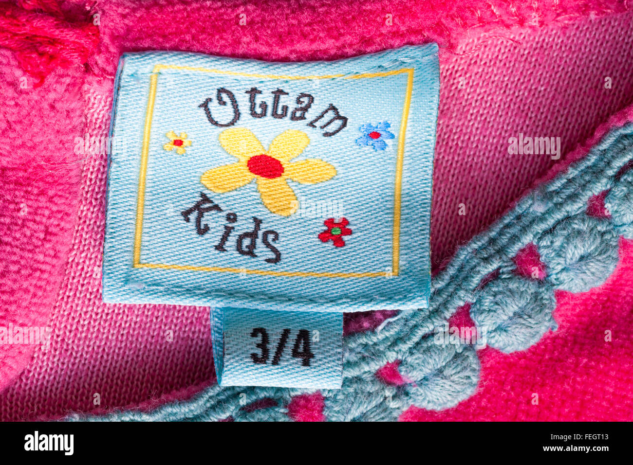 Uttam Kids label in girl's pink dress age 3/4 Stock Photo