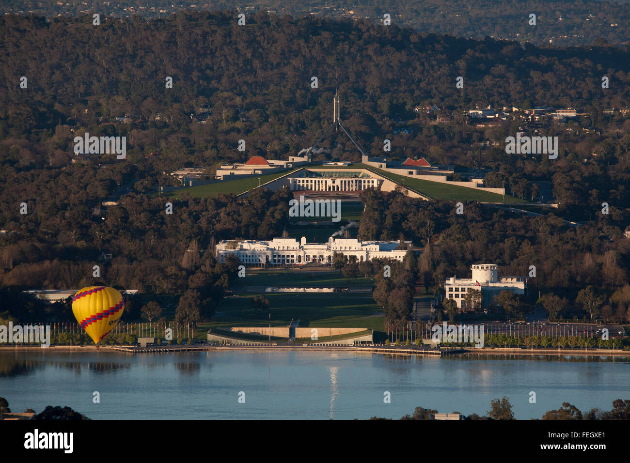 Hot Air Balloon passing over Federal Parliament House on Capital Hill Canberra ACT Australia Stock Photo