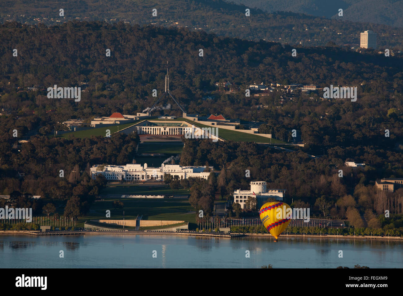 Hot Air Balloon passing over Federal Parliament House on Capital Hill Canberra ACT Australia Stock Photo