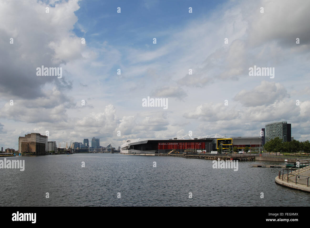 View up Royal Victoria Dock past Excel Exhibition Centre to Canary Wharf London UK Stock Photo