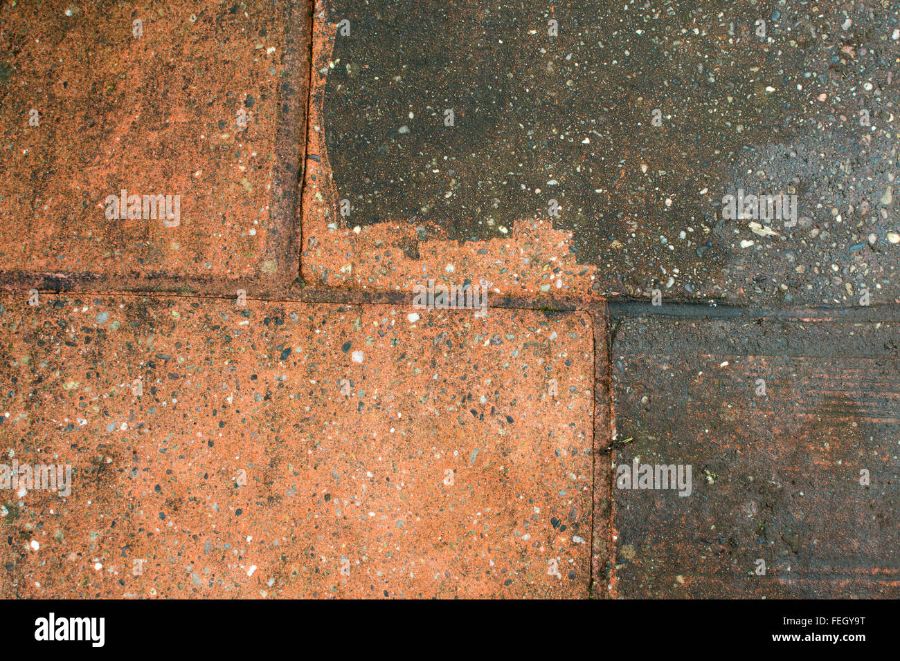 Dirty patio demonstating before and after power washing Stock Photo
