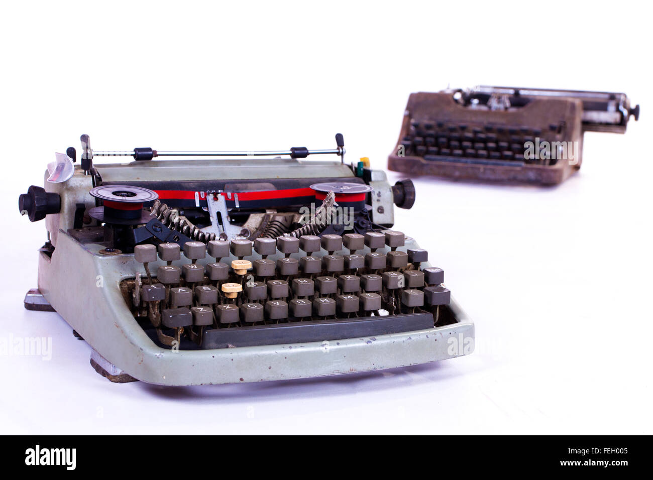 two typewriters on a white background Stock Photo