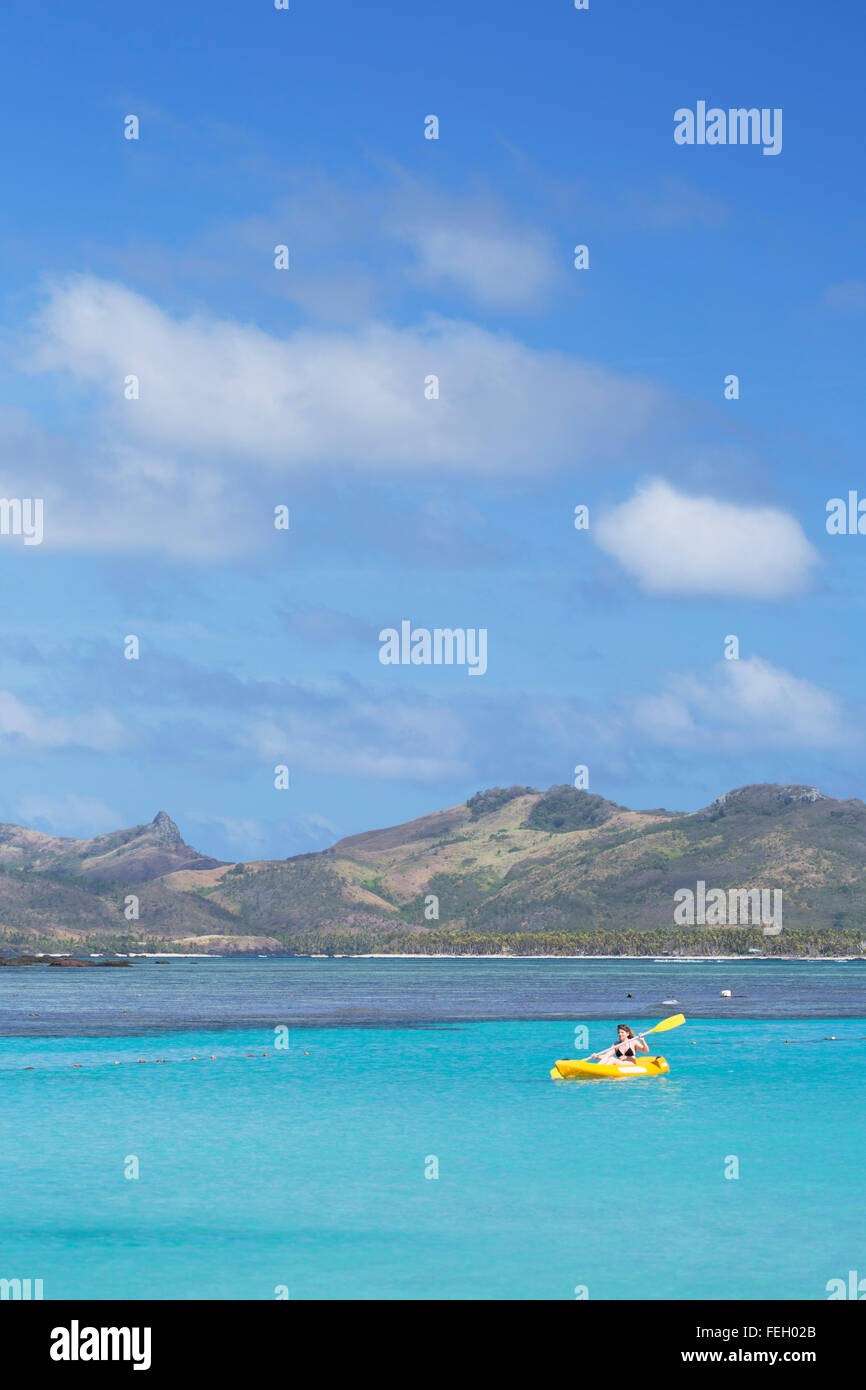 Woman kayaking in Blue Lagoon, Nacula Island, Yasawa Islands, Fiji