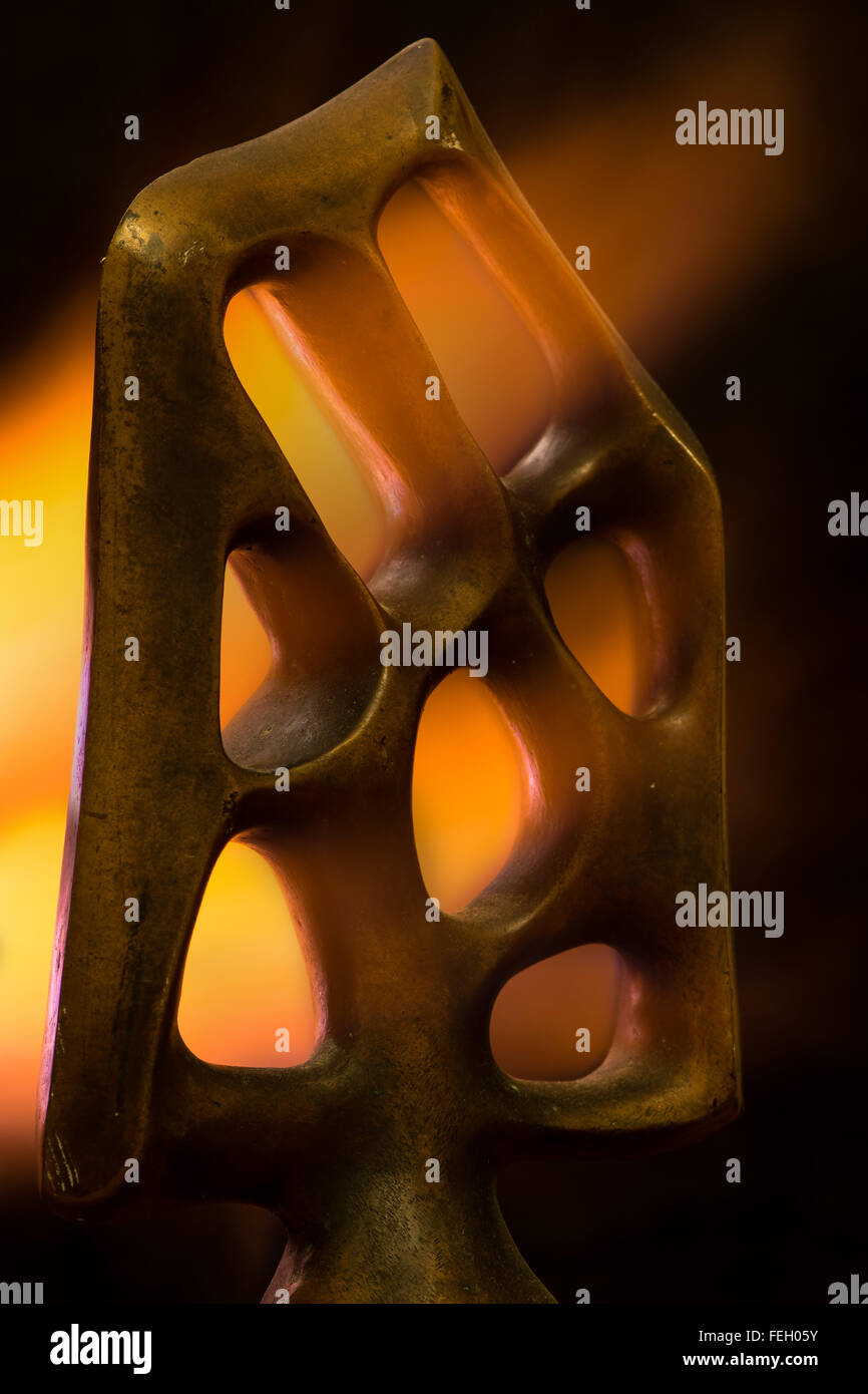 Tree of the Knowledge of Good and Evil. An old bronze by Aslanov, with fire flowing through Stock Photo