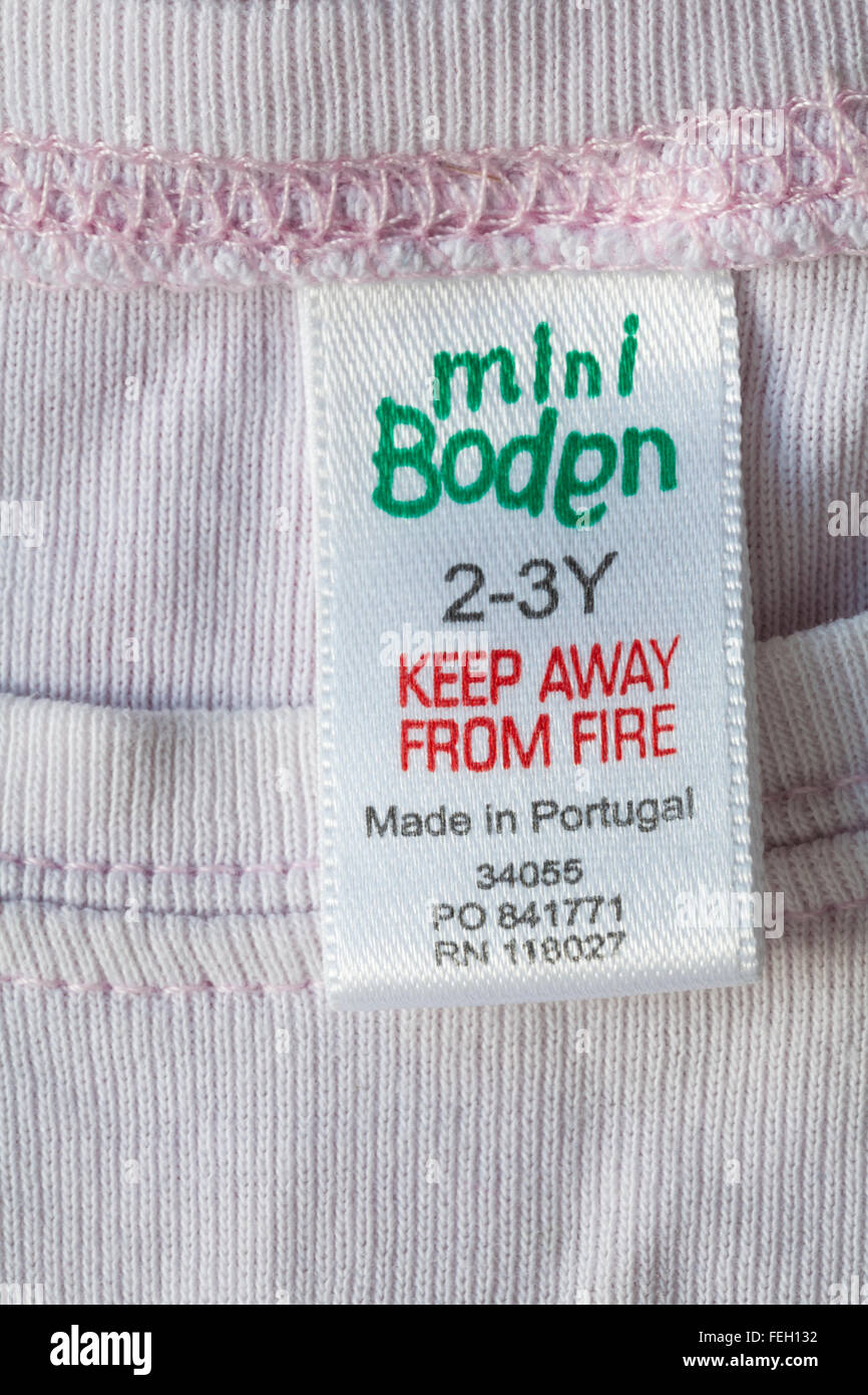 Keep away from fire label in mini Boden garment for 2-3Y made in Portugal - sold in the UK United Kingdom, Great Britain Stock Photo