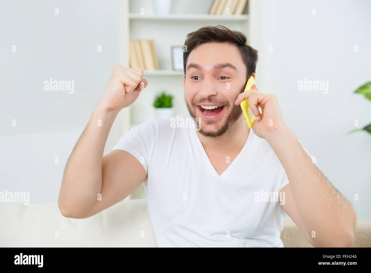 Cheerful man is ready to celebrate the good news. Stock Photo