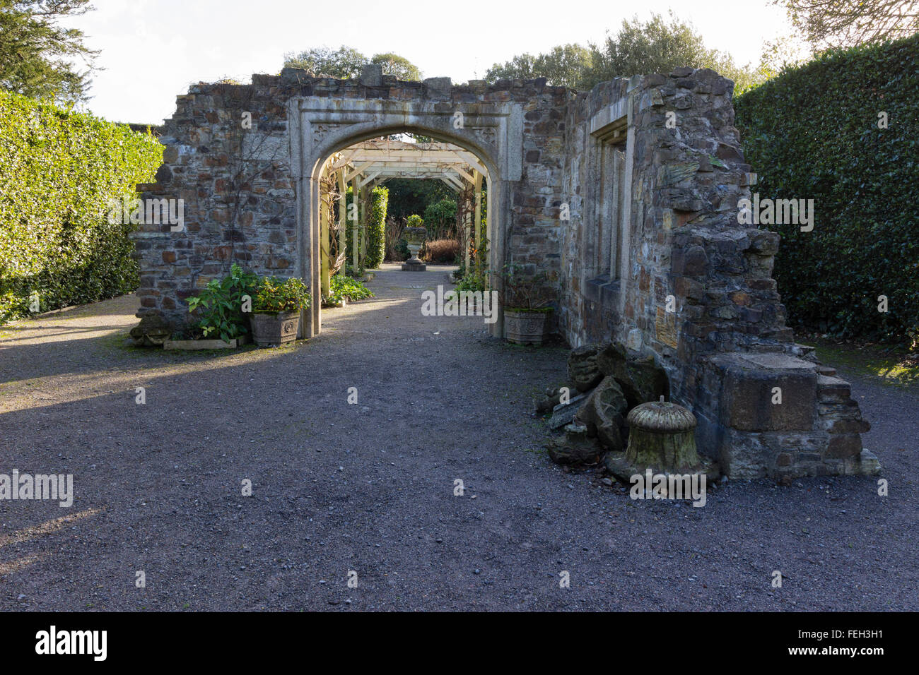 Late winter sunlight lights the reconstructed stonework of the relic garden at Mt Edgcumbe, Cornwall Stock Photo